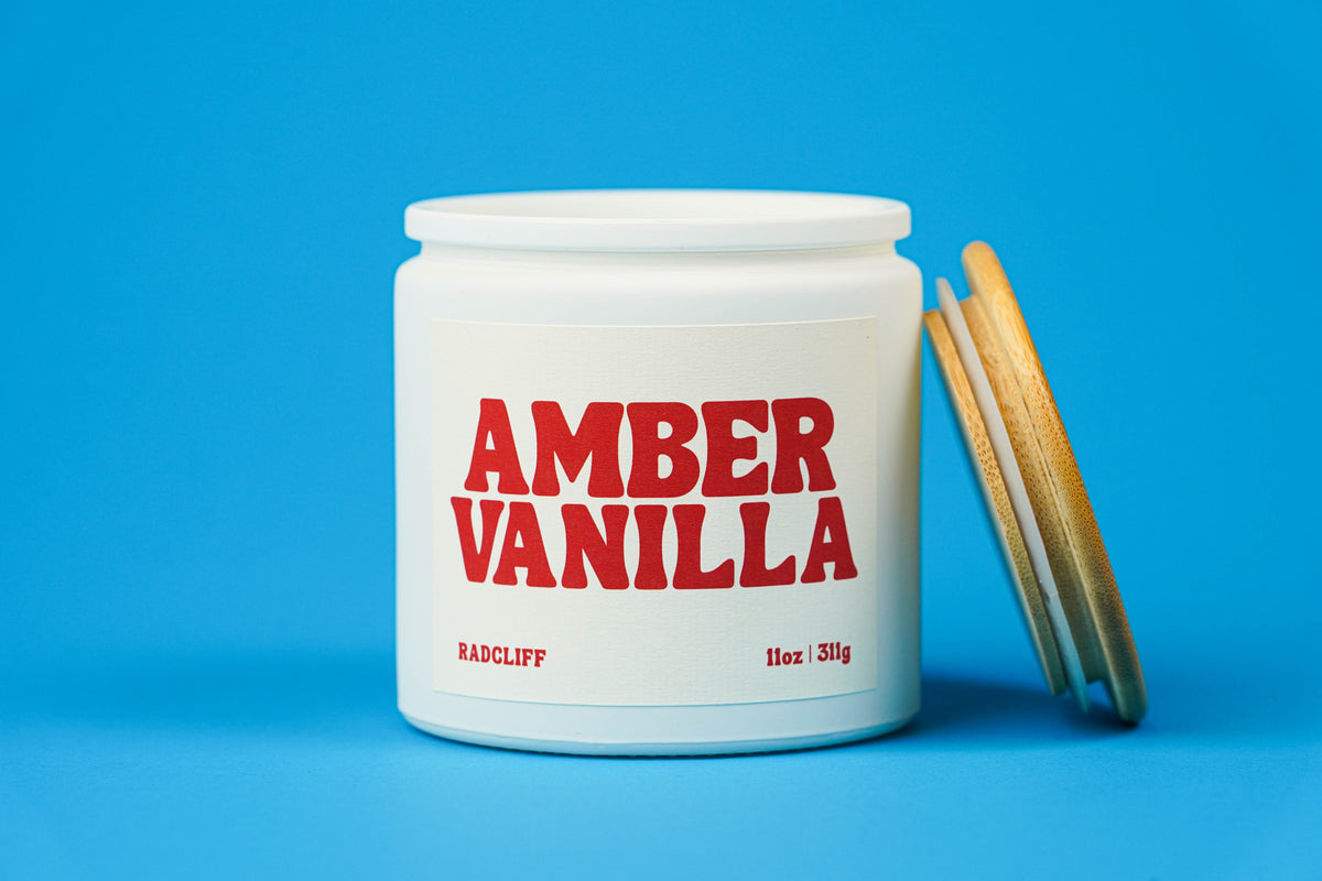 Amber Vanilla Candle - 11 oz white jar, lid off